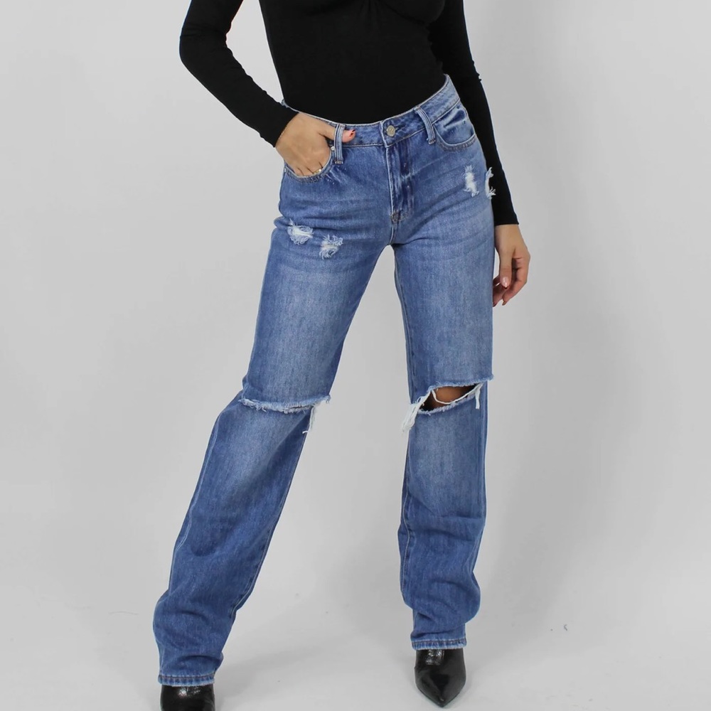 Blue denim straight leg distressed jeans.